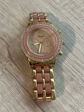 Geneva Gold Tone Watch with Pink Dial and Bracelet Inlays